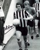 Bobby Moncur signed 10x8 inch black and white photo pictured leading Newcastle United out. Good