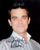 Robbie Williams signed 10x8 inch colour photo. Good condition. All autographs are genuine hand