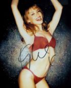 Kylie Minogue signed 10x8 inch colour photo. Good condition. All autographs are genuine hand