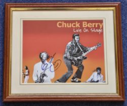 Chuck Berry signed 14x12 inch overall mounted and framed Live On-Stage colour photo. Good condition.