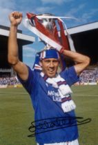 Autographed MARK HATELEY 12 x 8 photo : Col, depicting Rangers centre forward MARK HATELEY holding
