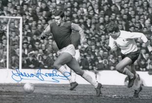 Autographed TREVOR BROOKING 12 x 8 photo : B/W, depicting a superb image showing West Ham United's