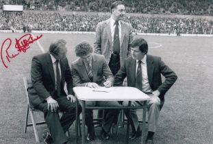 Autographed RON ATKINSON 12 x 8 photo : B/W, depicting Bryan Robson putting pen to paper for