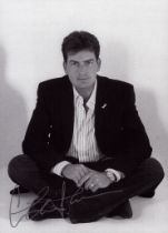 Charlie Sheen signed 7x5 inch black and white photo. Good condition. All autographs are genuine hand