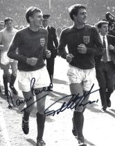 Martin Peters and Geoff Hurst signed 10x8 inch black and white photo pictured celebrating after