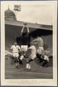 Football, Peter McParland signed 12x18 black and white photograph pictured as he challenges