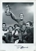 Ron Chopper Harris signed 16x12 inch black and white print pictured celebrating with the FA cup with