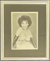 Music. Shirley Bassey Signed black and white photo, housed in a silver effect frame measuring 11 x 9