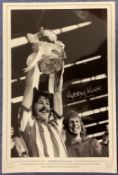 Bobby Kerr signed Sunderland 1973 FA Cup 16x12 inch black and white print pictured lifting the FA