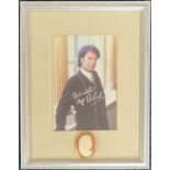 Music. Cliff Richard Signed colour photo housed in a silver effect frame measuring 11 x 9 inches
