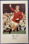 Denis Law signed 20x12 inch Manchester United colour print pictured in action for Manchester United.