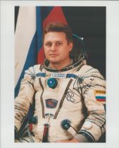 Cosmonaut Yuri Onufrienko signed 10 x 8 inch colour space suit photo. Good condition. All autographs