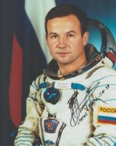 Cosmonaut Yuri Lonchakov signed 10 x 8 inch colour space suit photo. Good condition. All