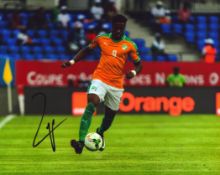 Football Wilfred Zaha signed 10x8 inch colour photo pictured in action for the Ivory Coast. Good