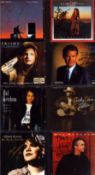 Music collection of 8 signed CDs including names of Glen Campbell, Joh Prine, Kathy Mattea and more.