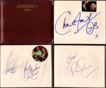 Entertainment collection of various autographs in a hard cover autograph book, including names of