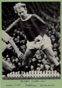 Bobby Charlton signed 6x8 vintage magazine black and white photo. Pictured in action for Man United.