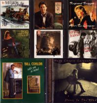 Music collection of 8 signed CDs including names of The Mavericks, Pam Tillis, Raymond Proggatt