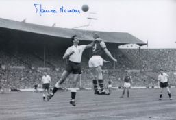 Autographed Maurice Norman 12 X 8 Photo : B/W, Depicting Tottenham's Maurice Norman Competing With