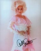 Dolly Parton signed 10x8 inch colour photo. Good Condition. All signed items come with our