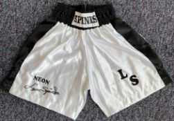 Boxing Legend, Leon Spinks Signed Personalised Boxing Shorts. These white shorts are signed in black