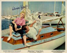 Lauren Bacall signed 10x8 inch vintage "Designing Woman" lobby card. Good Condition. All signed