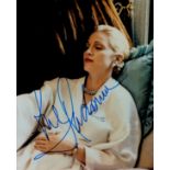 Madonna signed 10x8 inch colour photo pictured in her in role in the musical Evita. Good
