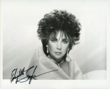Elizabeth Taylor signed 10x8 inch black and white photo. Good Condition. All signed items come