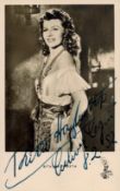 Rita Hayworth signed 6x4 inch black and white post card photo. Good Condition. All signed items come