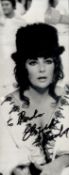 Elizabeth Taylor signed 10x4 black and white photograph dedicated and signed in black marker pen.