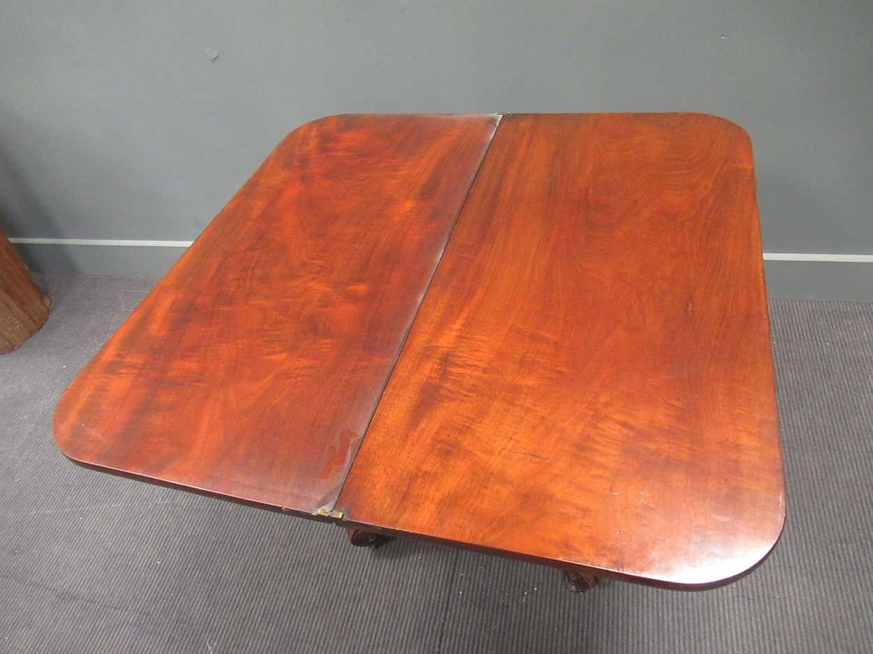 A Regency mahogany fold over tea table, the rounded rectangular top on a tapered column raised on - Image 8 of 9