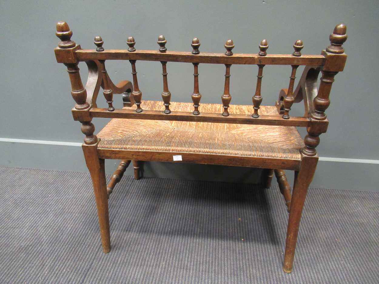 A 19th century rush seated hall chair, with down swept armsThe wood is stained beech. - Image 5 of 5