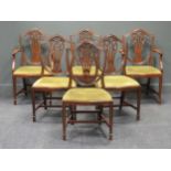 A set of six Hepplewhite style mahogany dining chairs, to include two carvers, with shield shaped