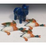 A graduated set of three Beswick flying ducks and a Rimini blue model of a horse attributed to