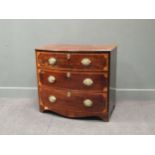A small 19th century mahogany and satinwood crossbanded bowfront chest, with three drawers on