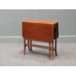 A Waring and Gillows mahogany Sutherland table, the rectangular canted drop flap top with