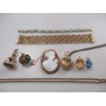 A cameo brooch stamped '9CT', a hallmarked 9ct gold fob, and two 9ct gold pendants gross weight 37.