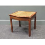 A cane work mahogany stool, 19th century, the serpentine hinged seat enclosing a smaller