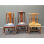An assortment of 3 dining chairs of different styles