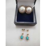 A pair of mabé pear ear studs stamped '9CT' together with a pair of turquoise and split pearl ear