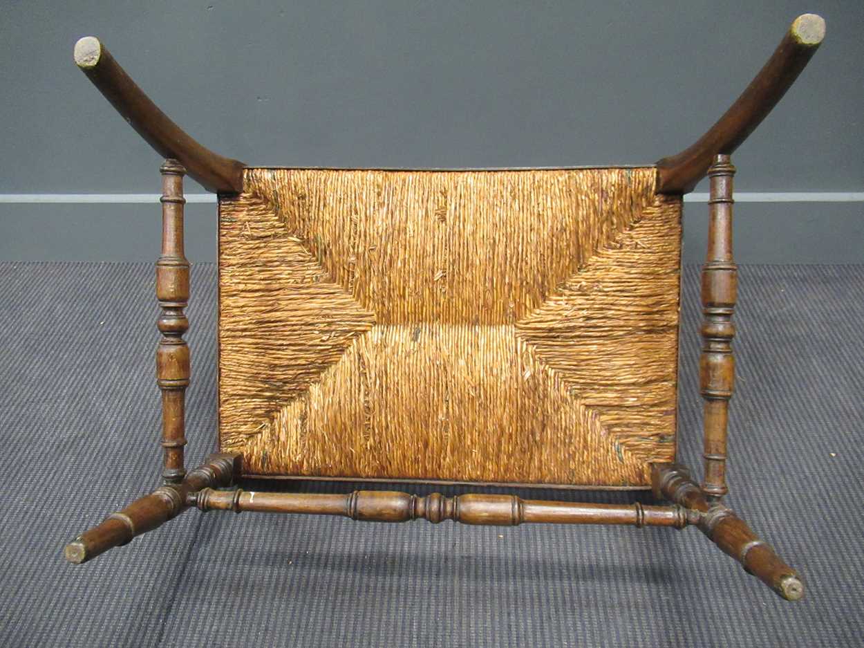 A 19th century rush seated hall chair, with down swept armsThe wood is stained beech. - Image 3 of 5