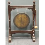 An Edwardian dinner gong, 85 x 57cm