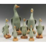 A collection of seven celadon glazed Chinese model ducks, the tallest 26cm high