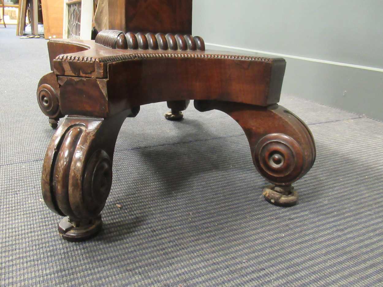 A Regency mahogany fold over tea table, the rounded rectangular top on a tapered column raised on - Image 6 of 9