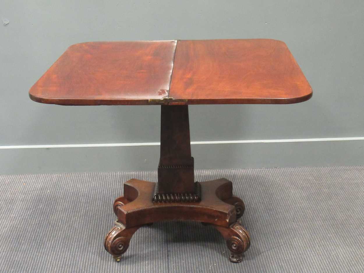 A Regency mahogany fold over tea table, the rounded rectangular top on a tapered column raised on - Image 9 of 9