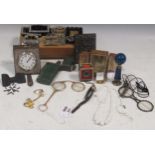 A small collection of costume jewellery together with a silver mounted travelling clock, a cased