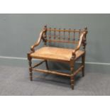 A 19th century rush seated hall chair, with down swept armsThe wood is stained beech.