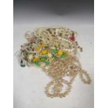 A collection of costume jewellery and beads