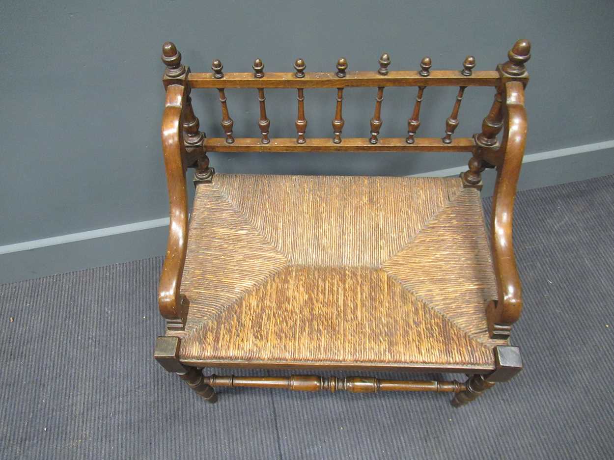 A 19th century rush seated hall chair, with down swept armsThe wood is stained beech. - Image 4 of 5