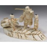 A faux ivory Okimono, 18cm high